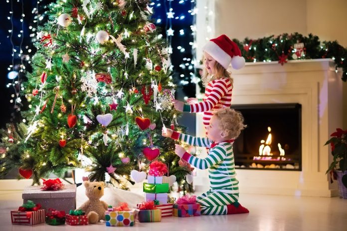 Kids decorating Christmas tree