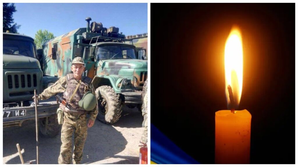 Військовий поряд з машинами, палаюча свічка