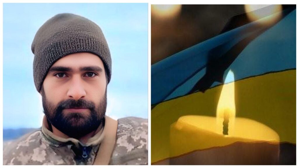 Військовий у формі з прапором і свічкою