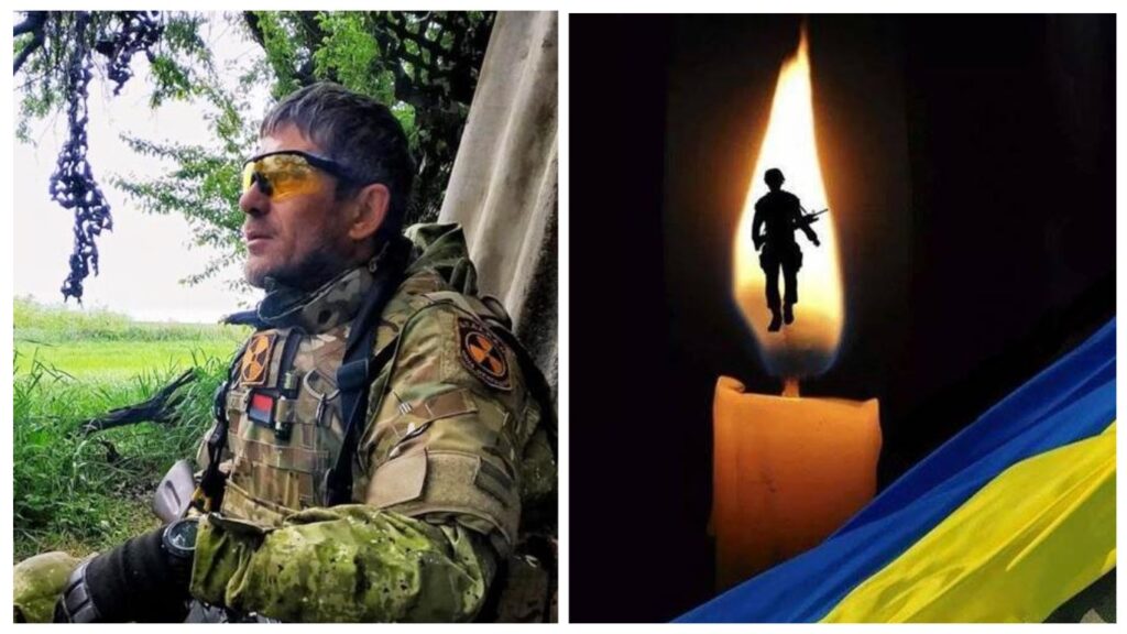 Військовий і свічка з українським прапором.