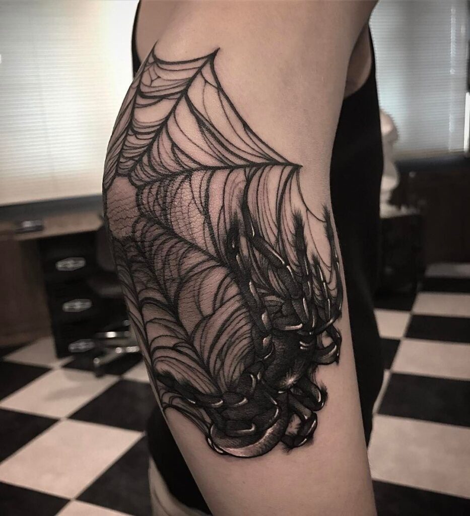 Что означает тату паутина на локте