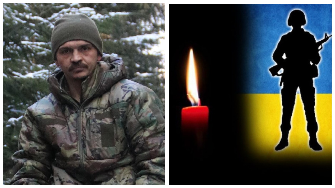Військовий у камуфляжі, свічка, прапор України.