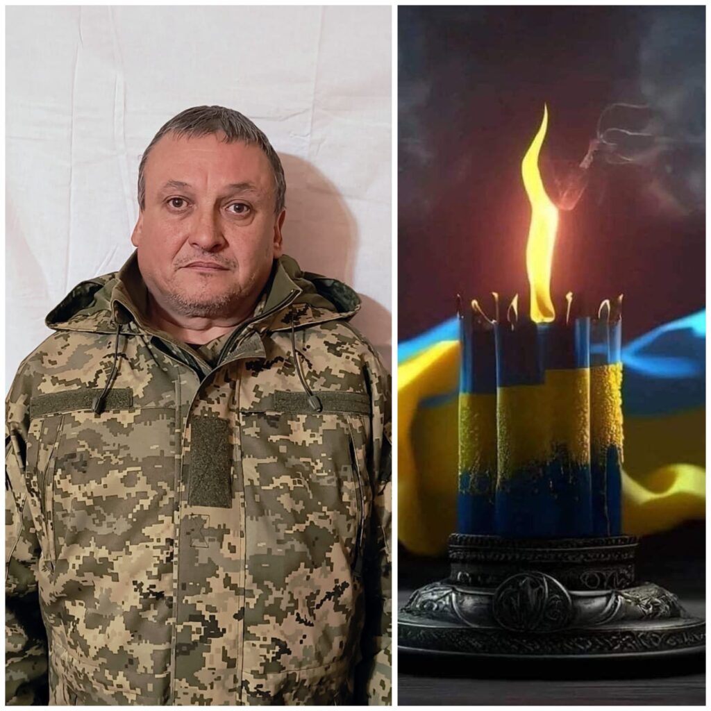 Чоловік у формі та свічка з прапором України.
