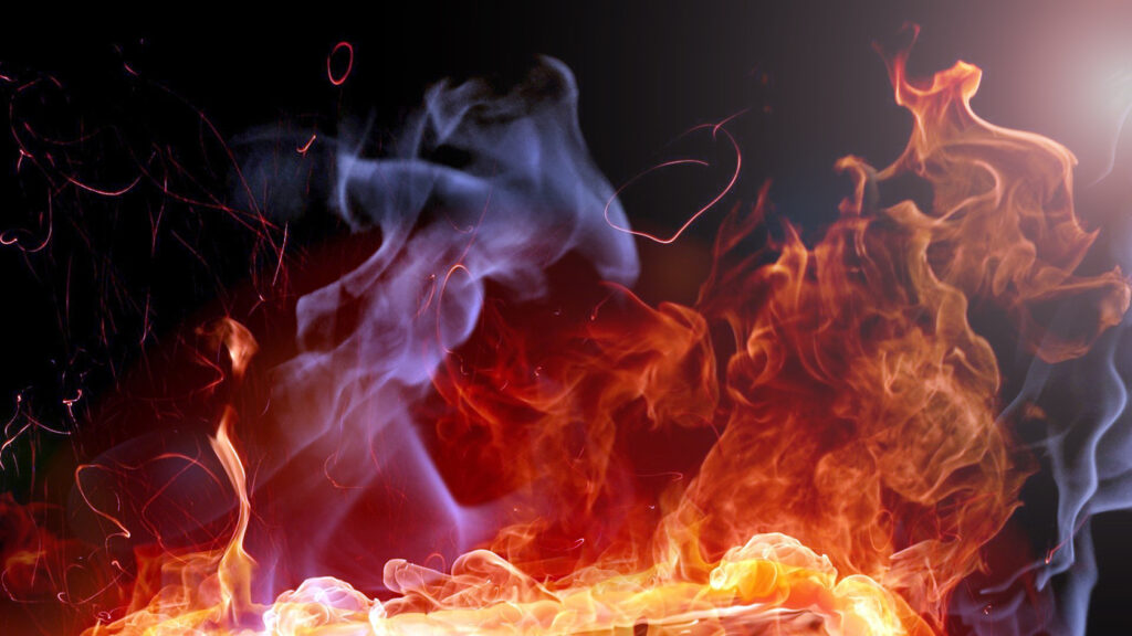 Полум'я та дим на темному тлі