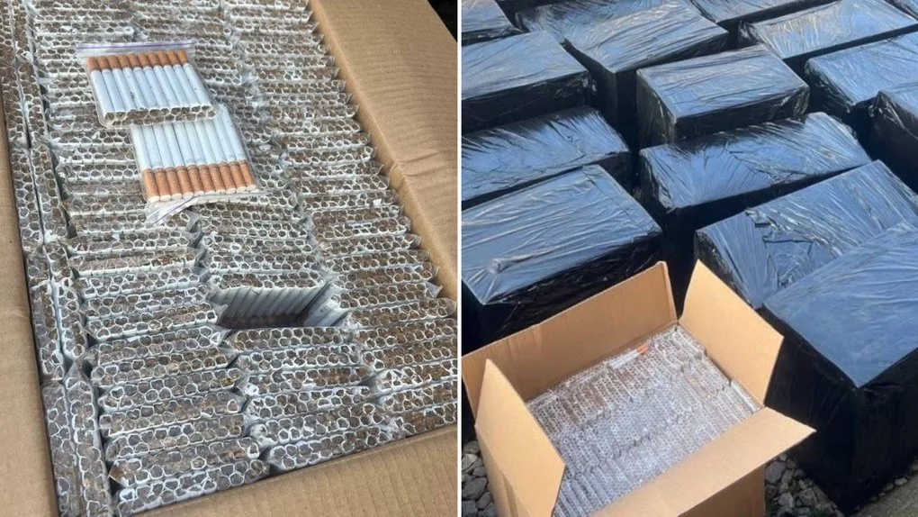 Коробки з сигаретами, упакованими у чорну плівку