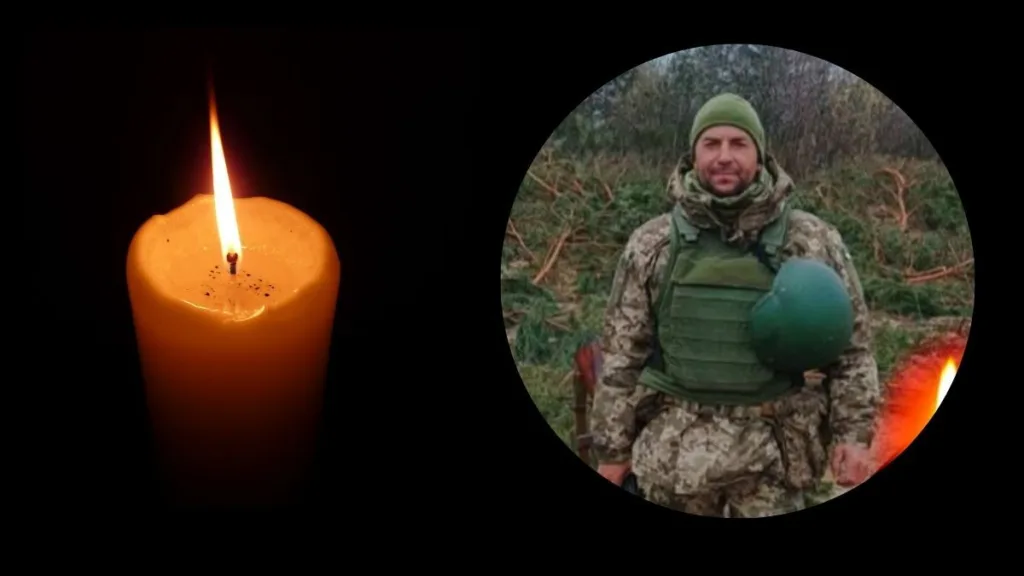 Палаюча свічка і український військовий у формі