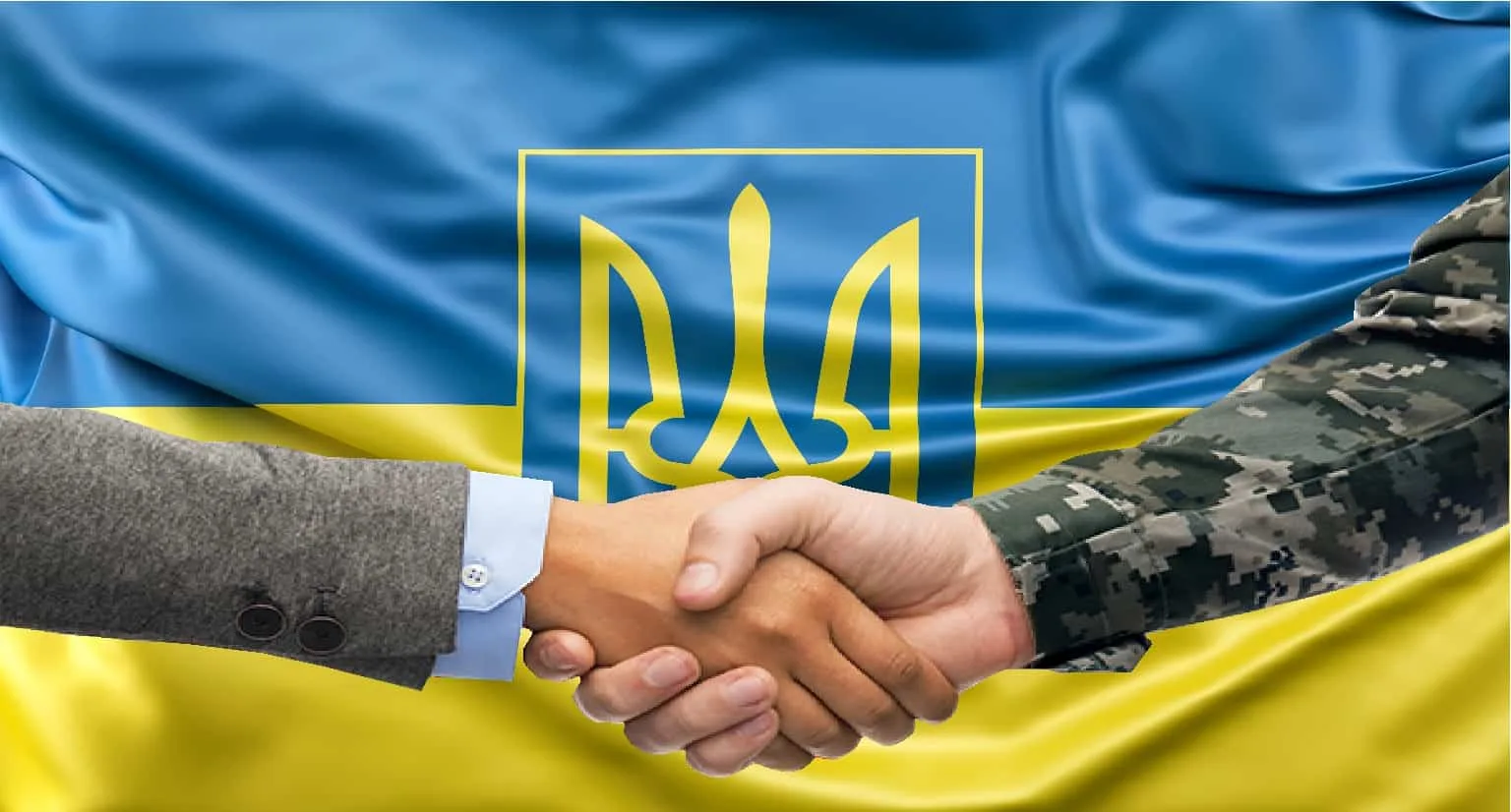 Рукостискання перед прапором України