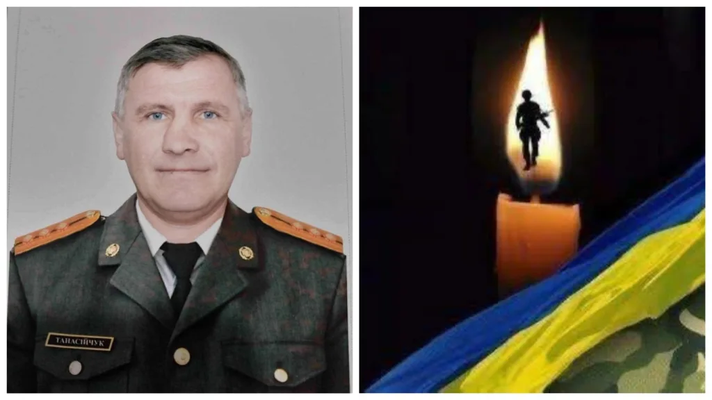 Військовий у формі та свічка пам’яті з прапором