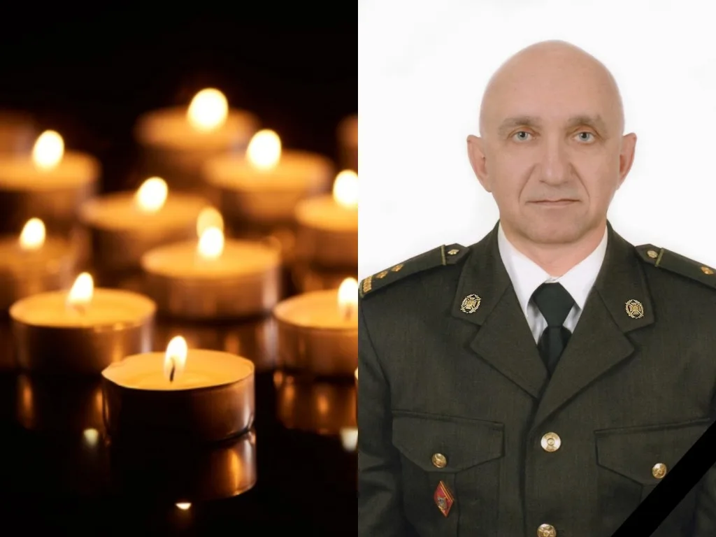 Свічки пам’яті та військовий у формі