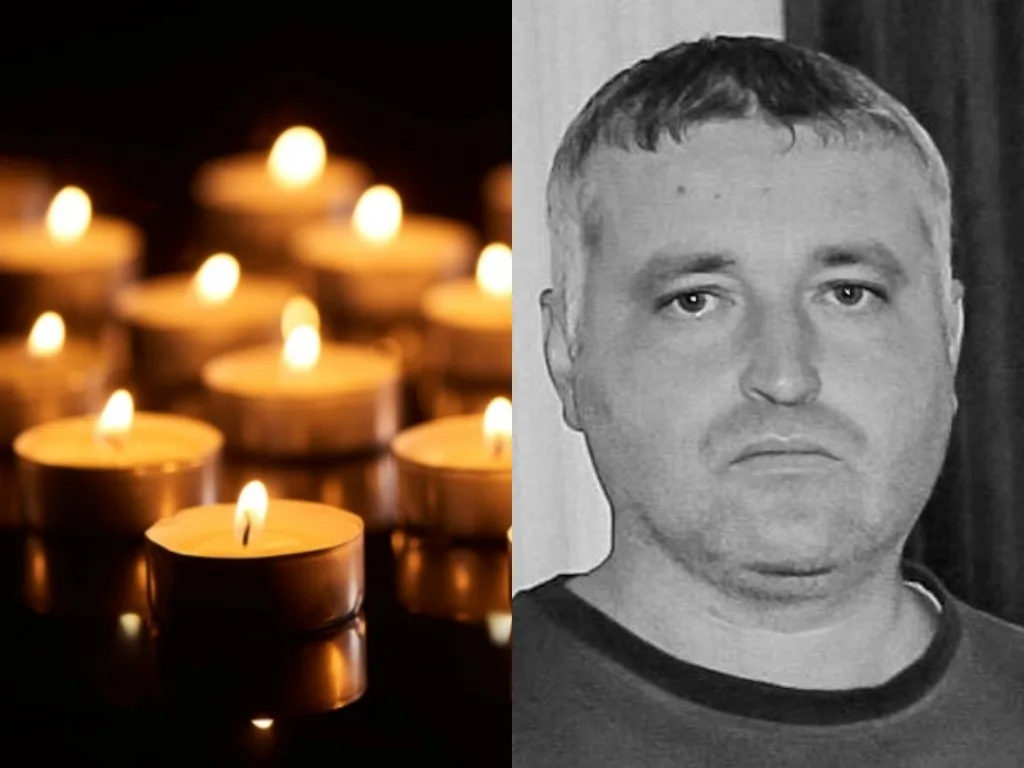 Палаючі свічки та портрет чоловіка в пам’ять