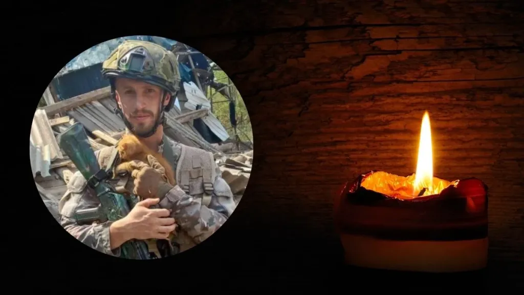 Військовий з собакою та палаюча свічка пам’яті