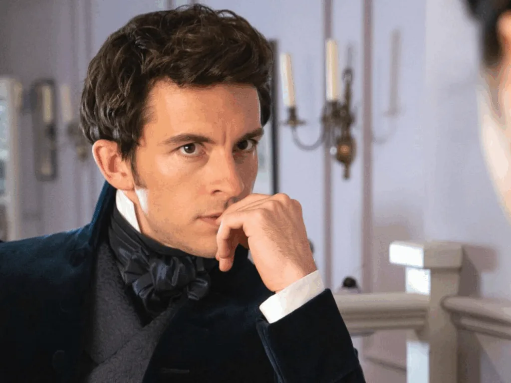 Чоловік у старовинному костюмі задумливо дивиться вбік