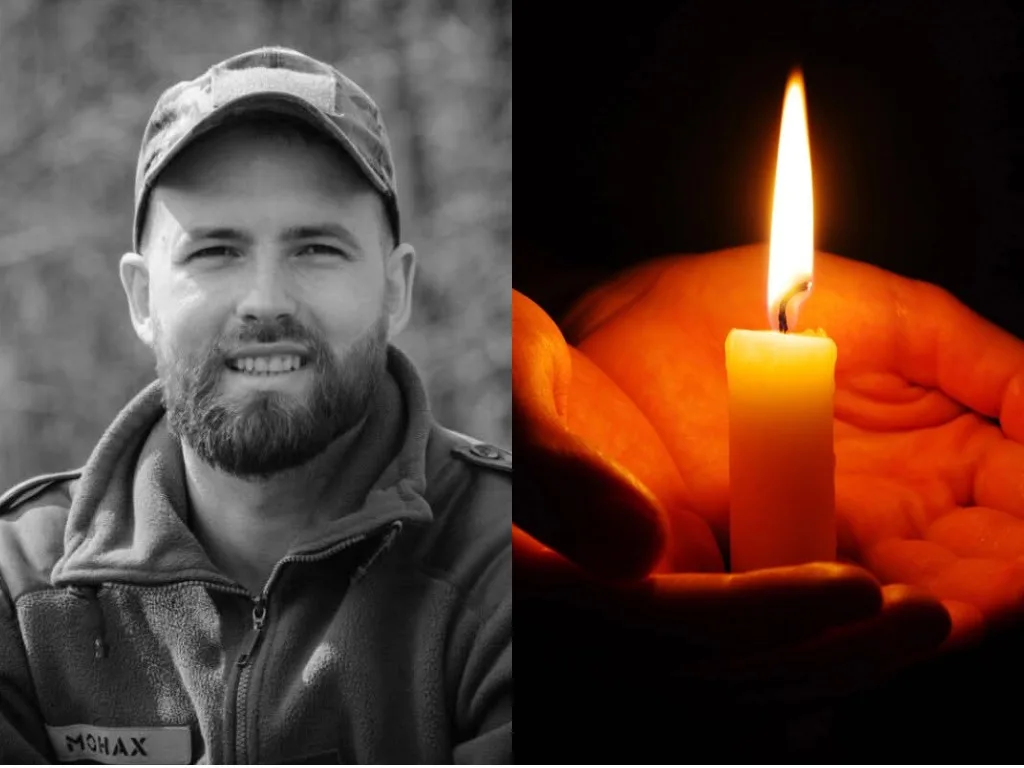 Військовий портрет і свічка пам’яті в руках