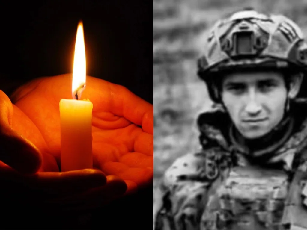 Свічка пам’яті та військовий у формі