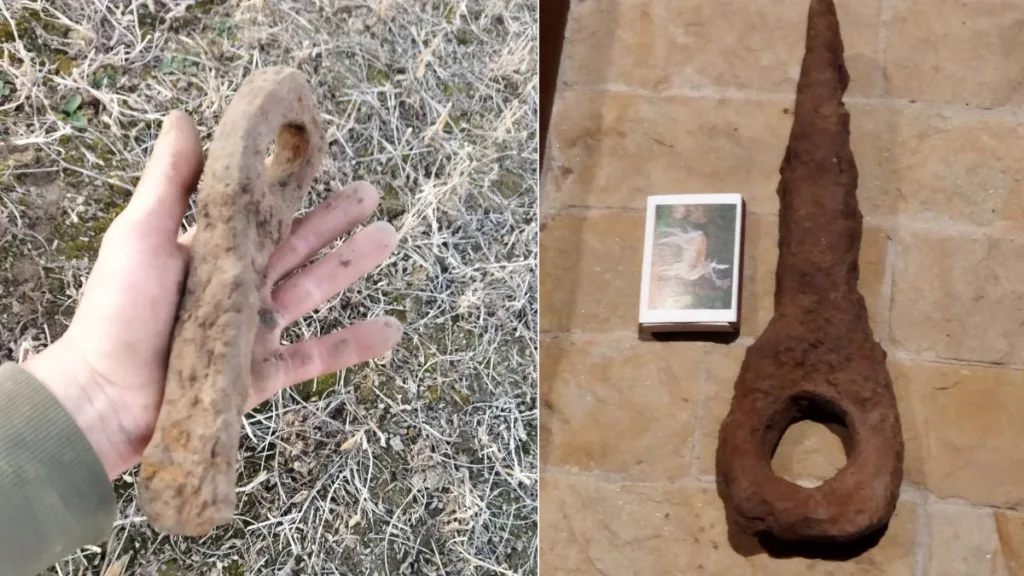 Іржавий металевий артефакт, знайдений у землі