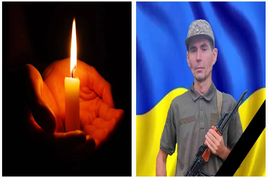 Свічка пам’яті та український військовий з прапором