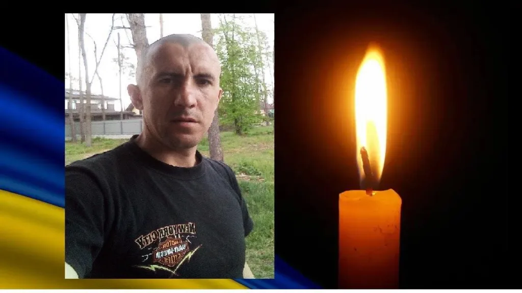 Портрет чоловіка і палаюча свічка пам’яті