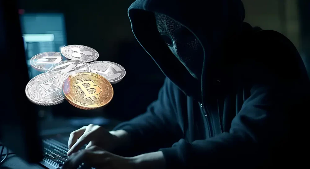 Хакер працює з криптовалютою на комп’ютері