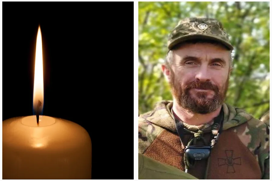 Свічка пам’яті та військовий у камуфляжі