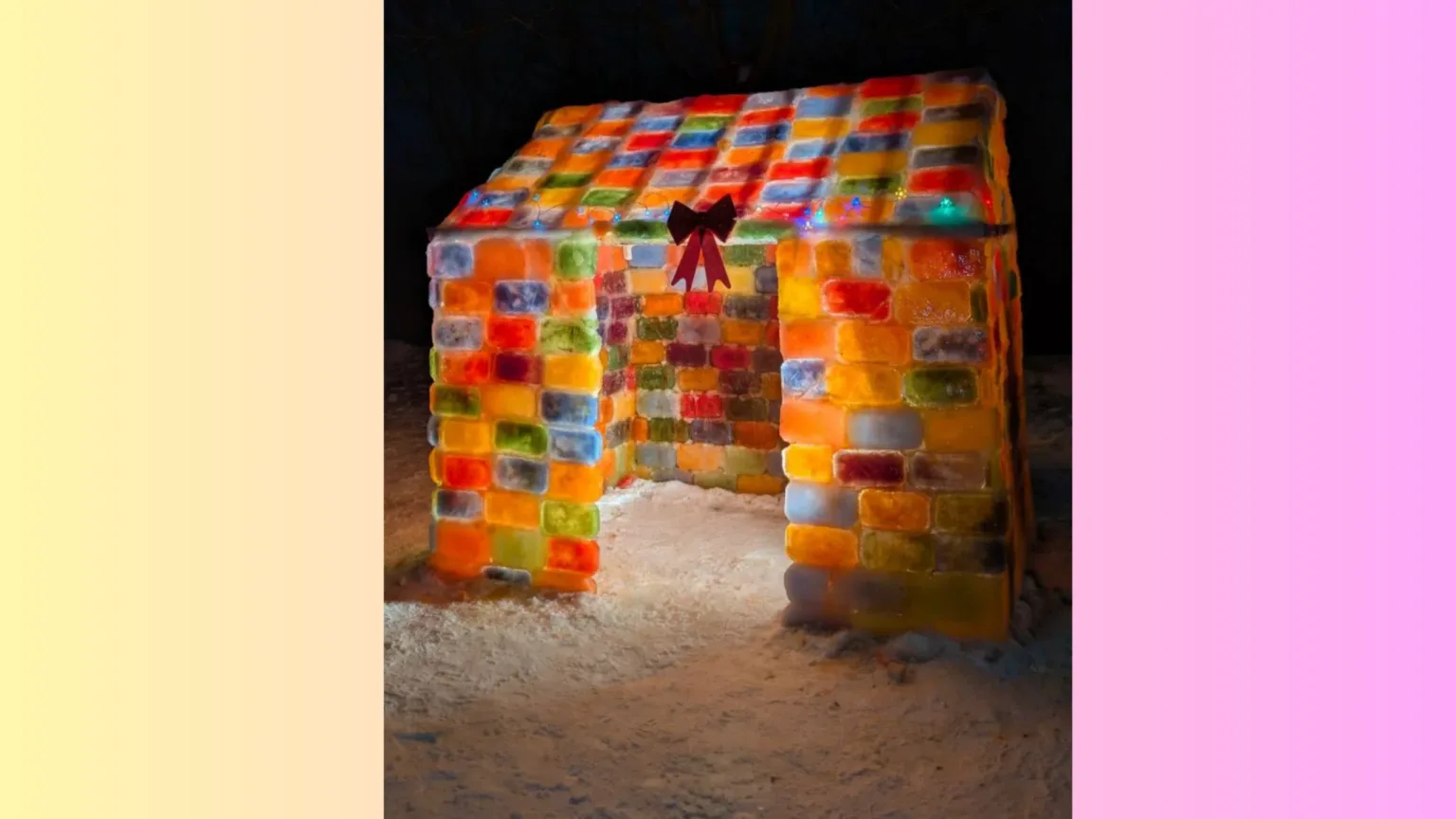 Барвистий будиночок з крижаних цеглин на снігу