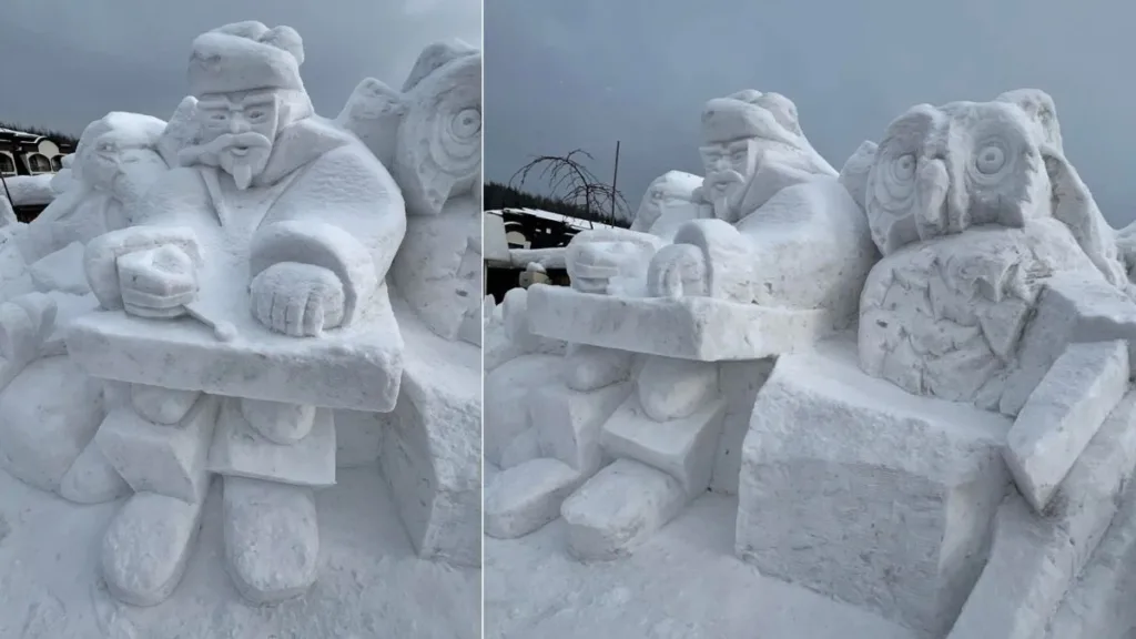 Снігова скульптура чоловіка та сови