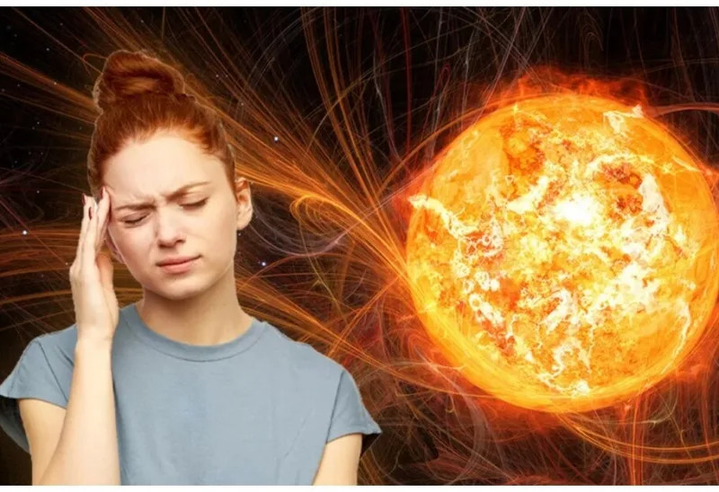 Жінка з головним болем поруч із сонячним спалахом