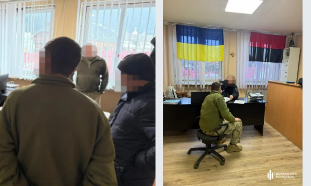 Військові спілкуються в офісі з прапорами України