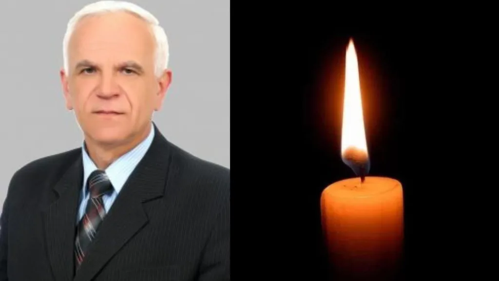 Портрет чоловіка поруч із палаючою свічкою