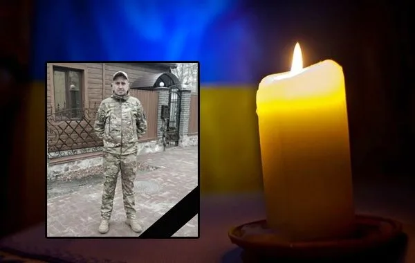 Пам’ять загиблого українського військового, палає свічка