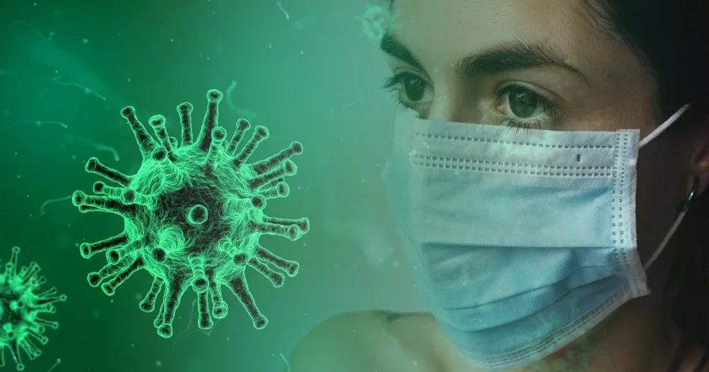 Людина в масці поруч із зображенням вірусу