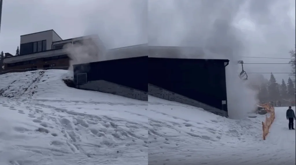 Дим з будівлі на засніженому схилі