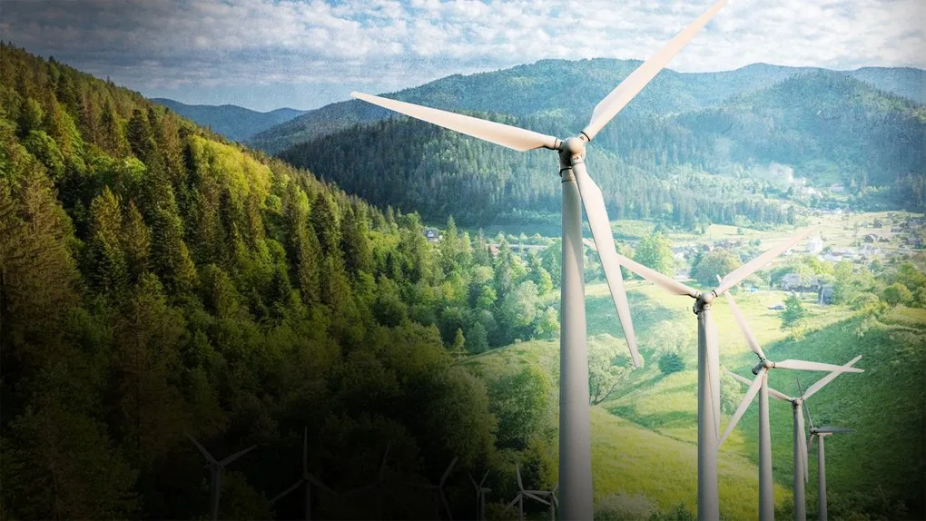 Вітрові турбіни серед зелених карпатських гір
