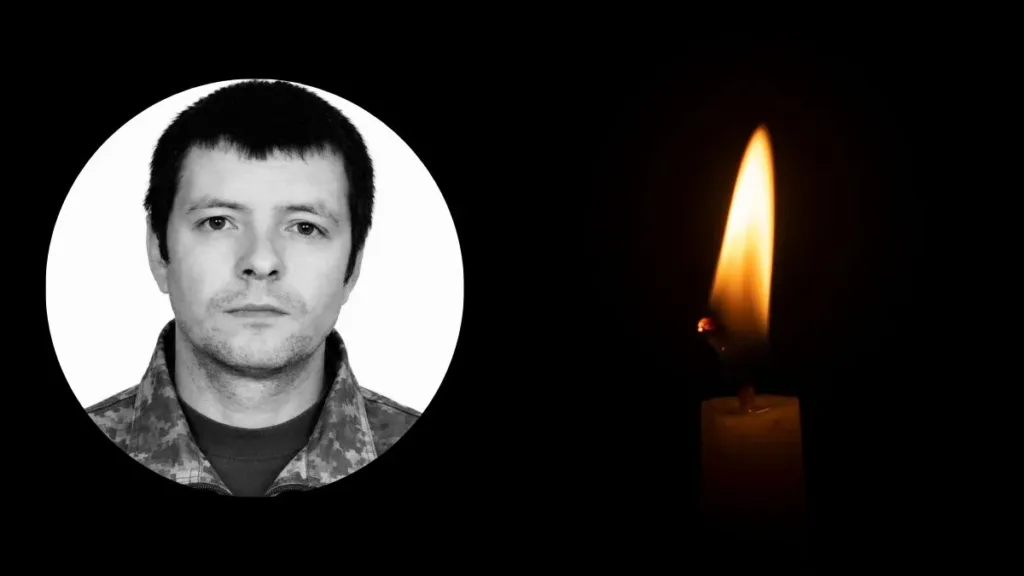 Портрет військового та палаюча свічка пам’яті