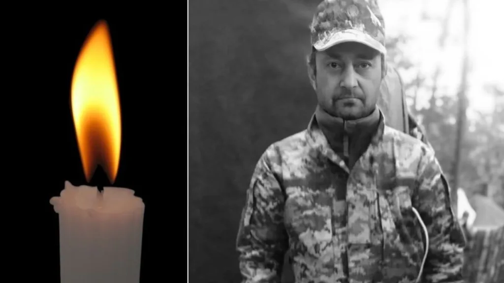 Свічка та військовий у камуфляжі