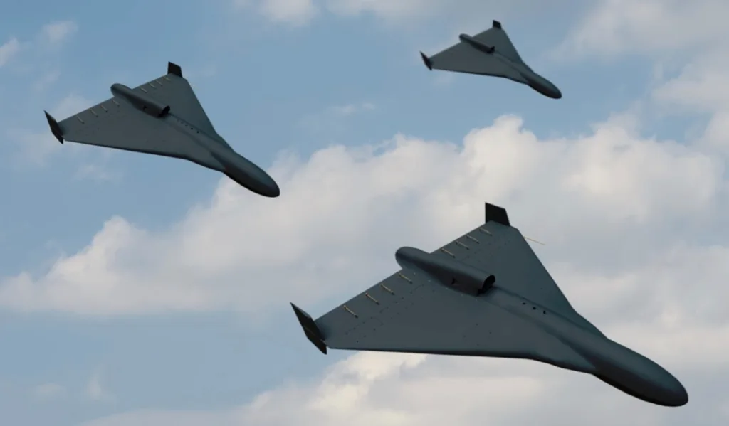 Три військові безпілотники летять у небі