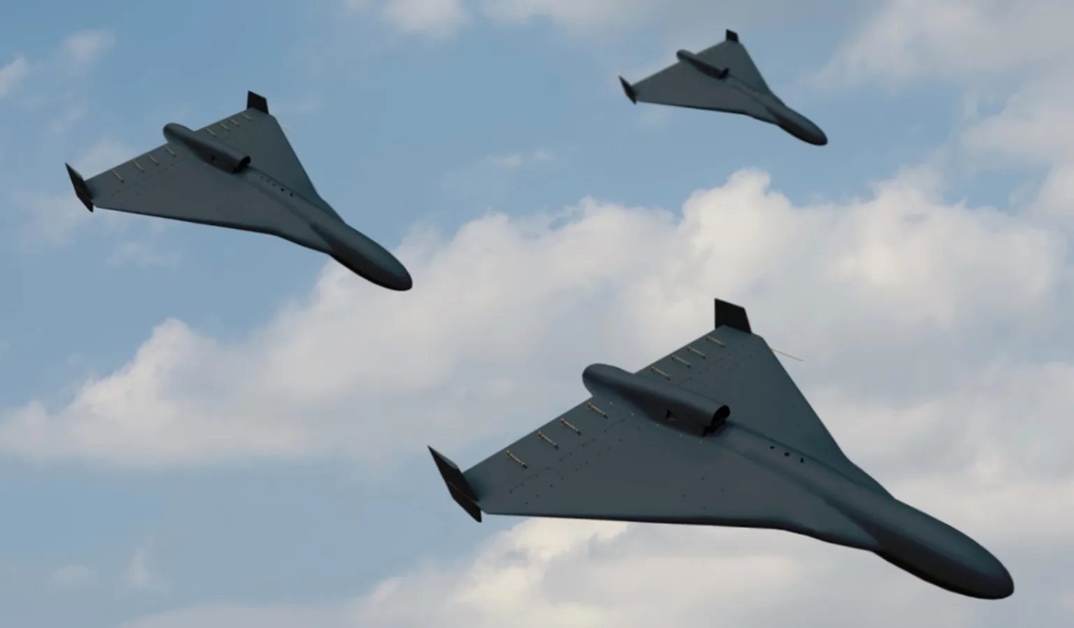 Три військові безпілотники летять у небі