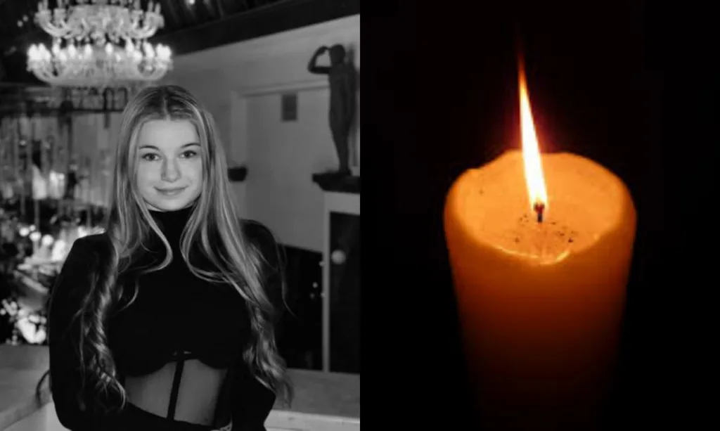 Жінка усміхається поруч із палаючою свічкою