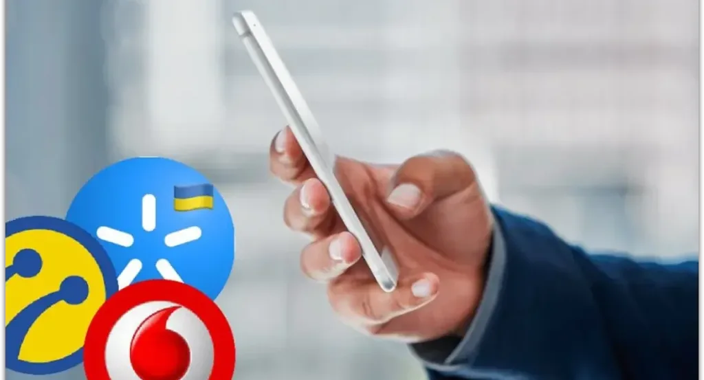 Людина тримає смартфон поруч із логотипами операторів