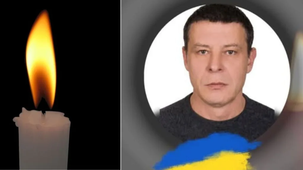 Свічка пам’яті та портрет чоловіка