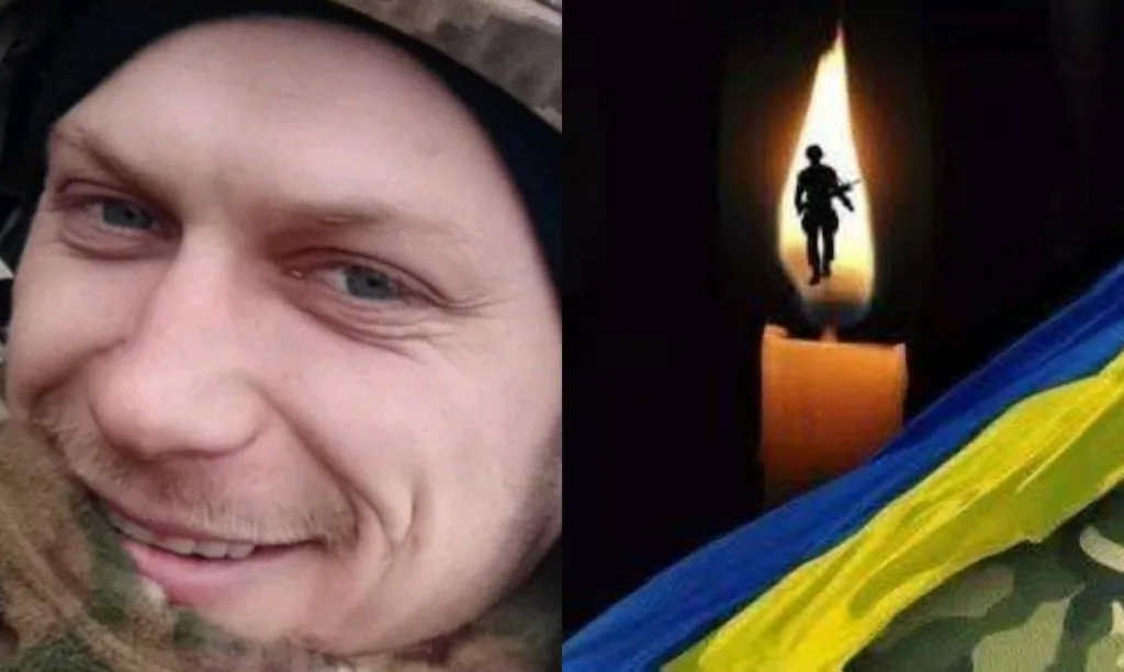 Український військовий і свічка пам’яті з прапором