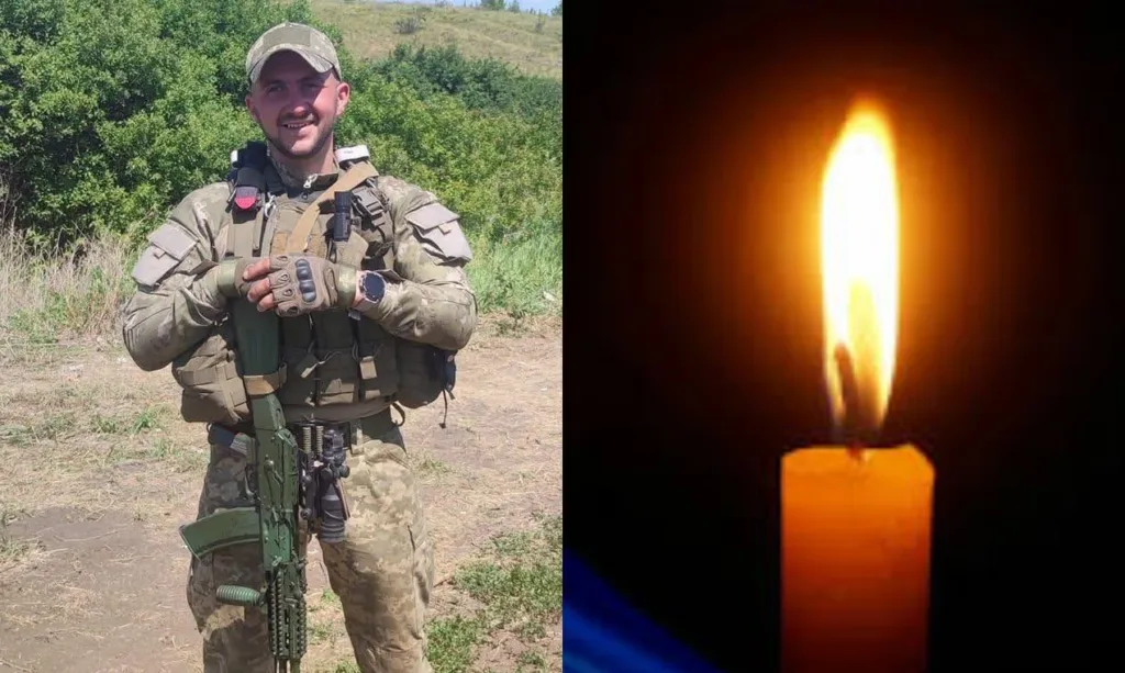 Військовий у формі та запалена свічка пам’яті