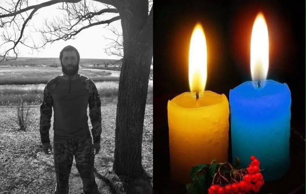 Військовий та дві свічки кольорів України