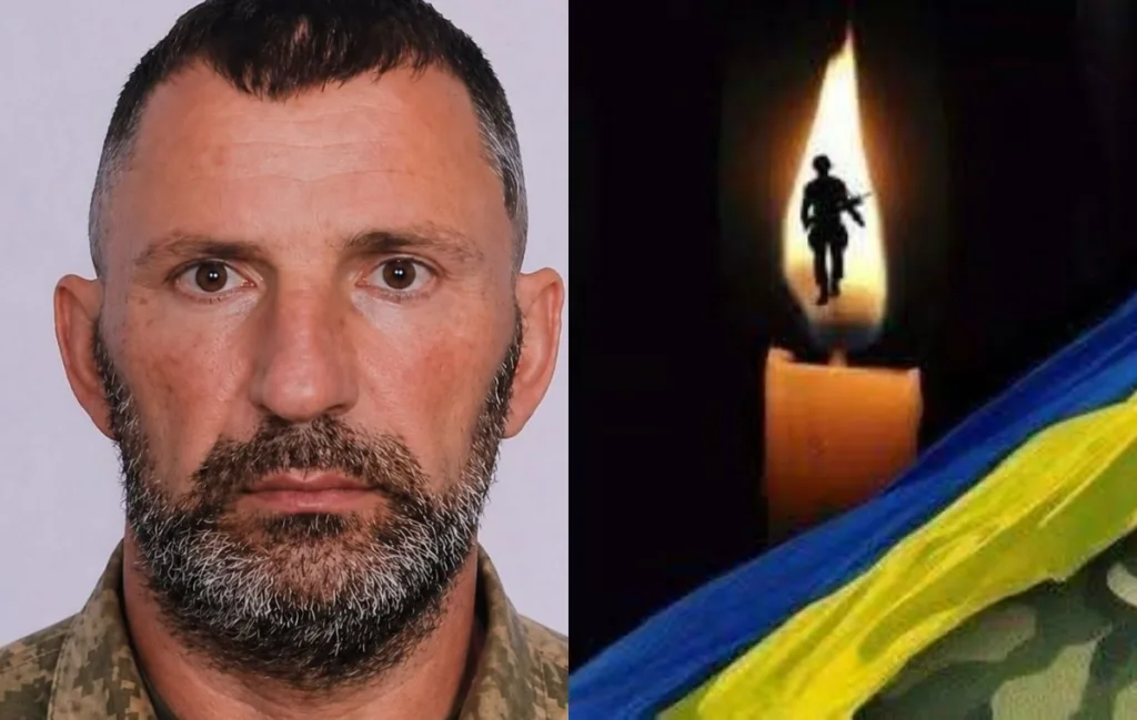 Український військовий та свічка пам’яті з прапором