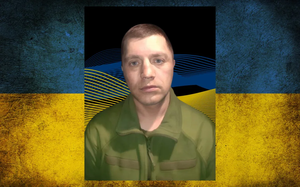 Військовий на тлі прапора України