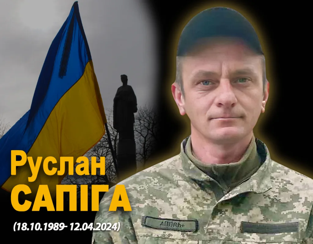 Український військовий на фоні прапора України
