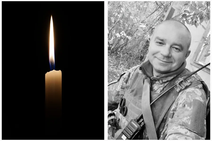 Свічка пам’яті та військовий у формі