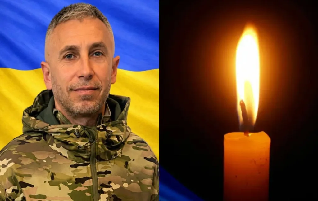 Військовий на тлі прапора України та свічка пам’яті