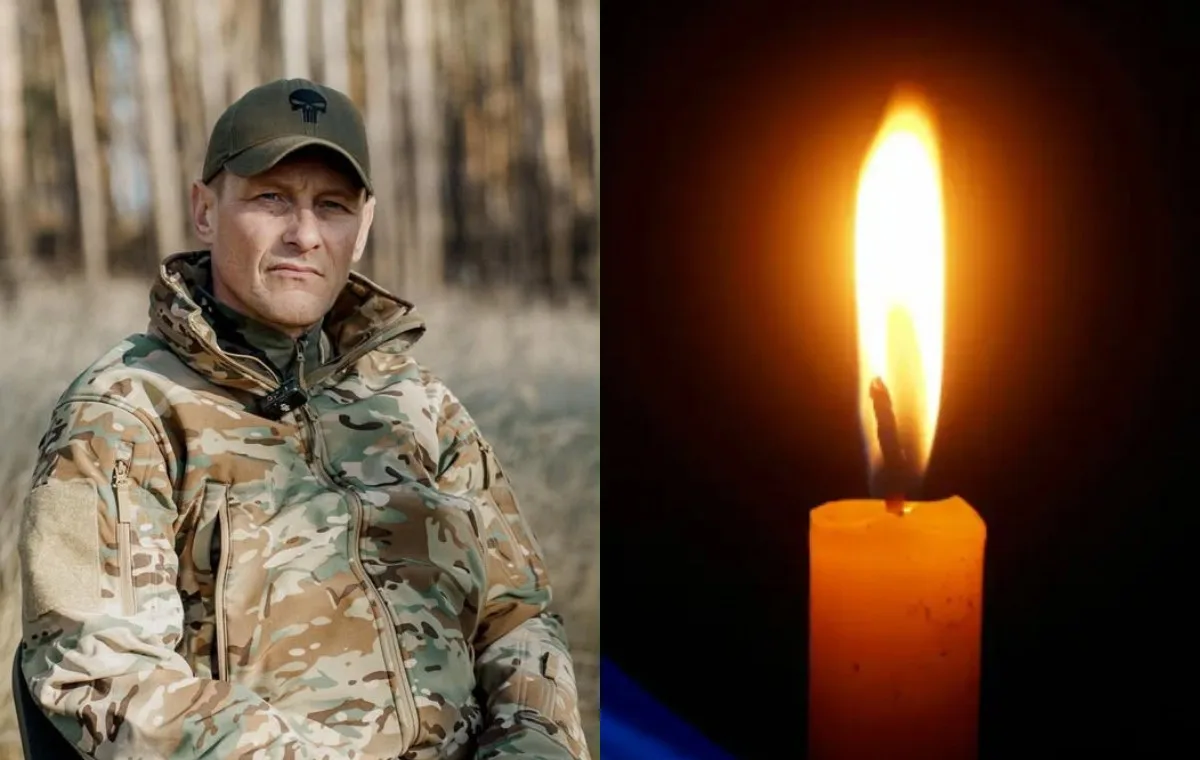 Військовий у камуфляжі та запалена свічка
