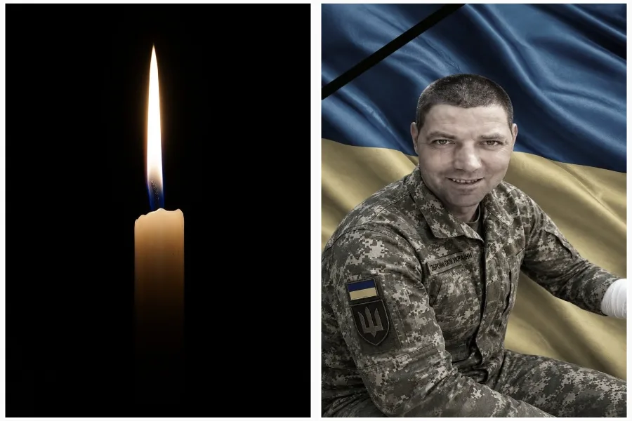 Свічка пам’яті та український військовий на фоні прапора