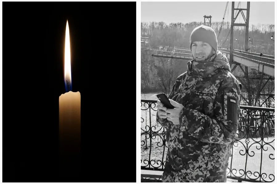 Свічка пам’яті та військовий у зимовому одязі